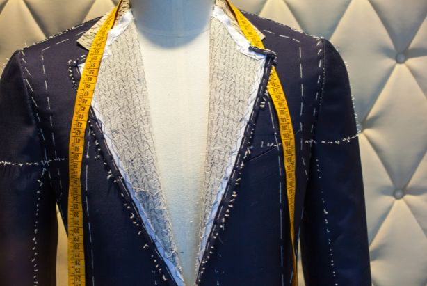 A basted jacket marked with white tacking thread