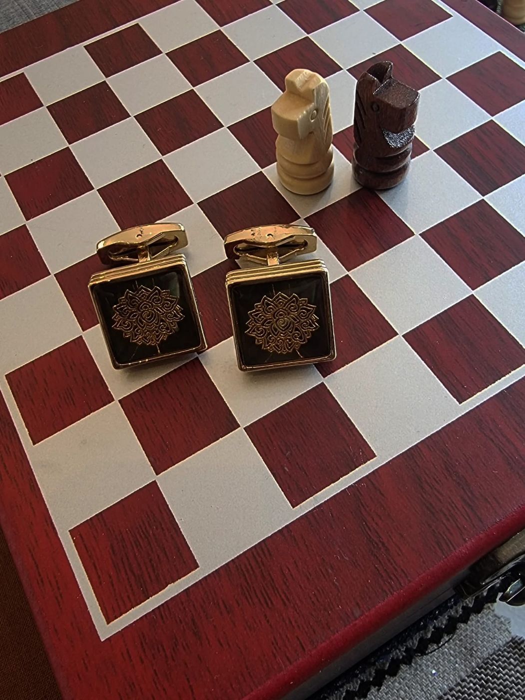 Cuff links on a chess board