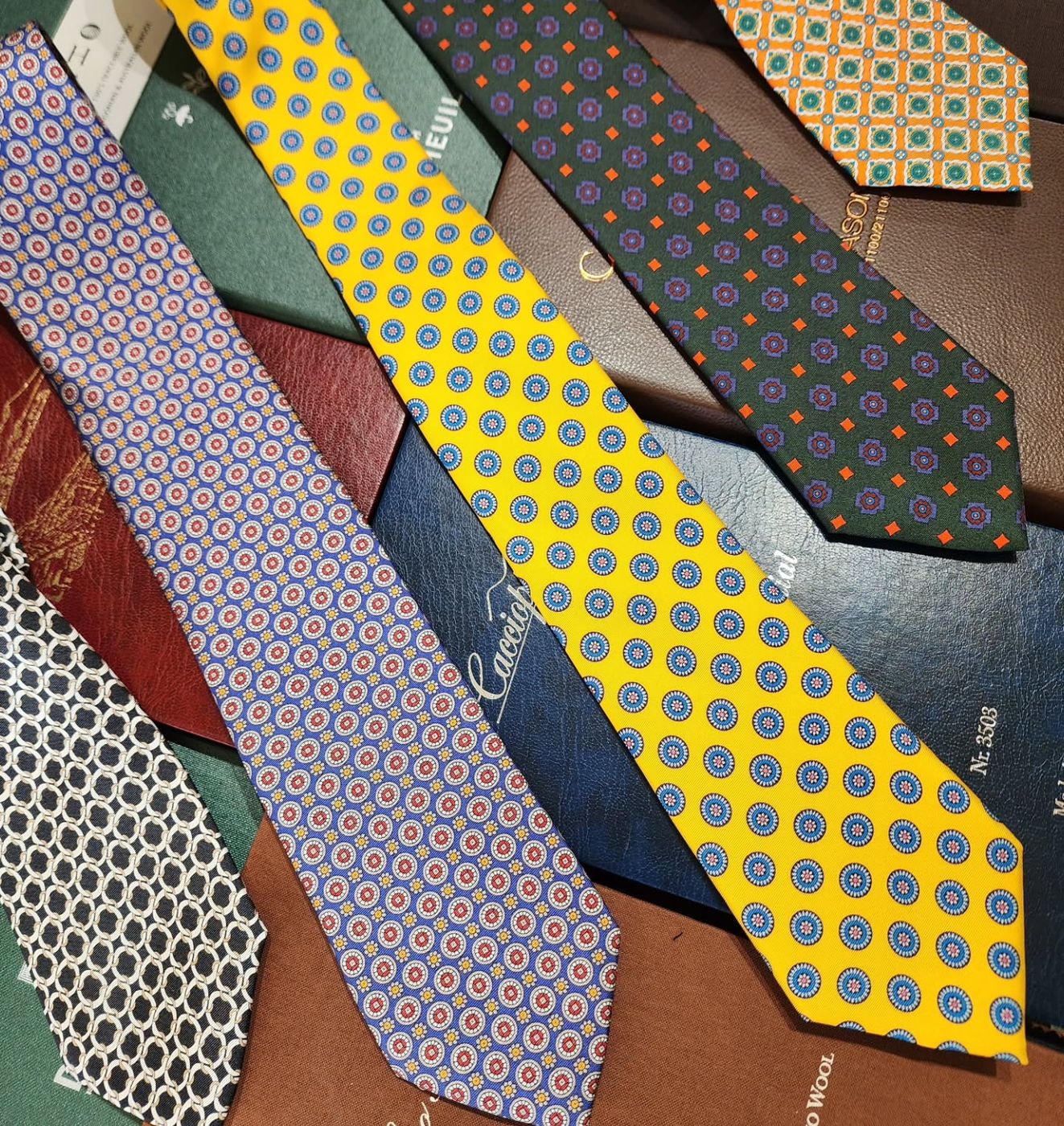 Printed silk ties in yellow, blue and green