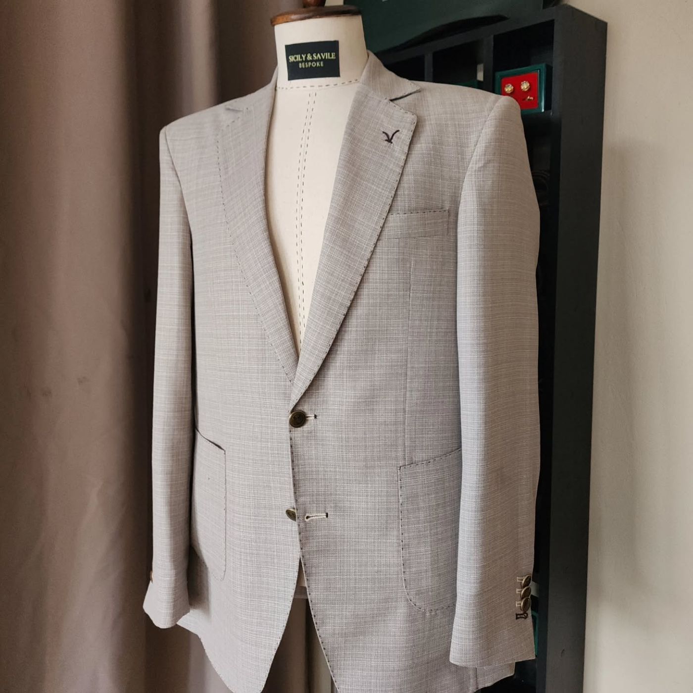 A light check sports coat with a Sicily & Savile label