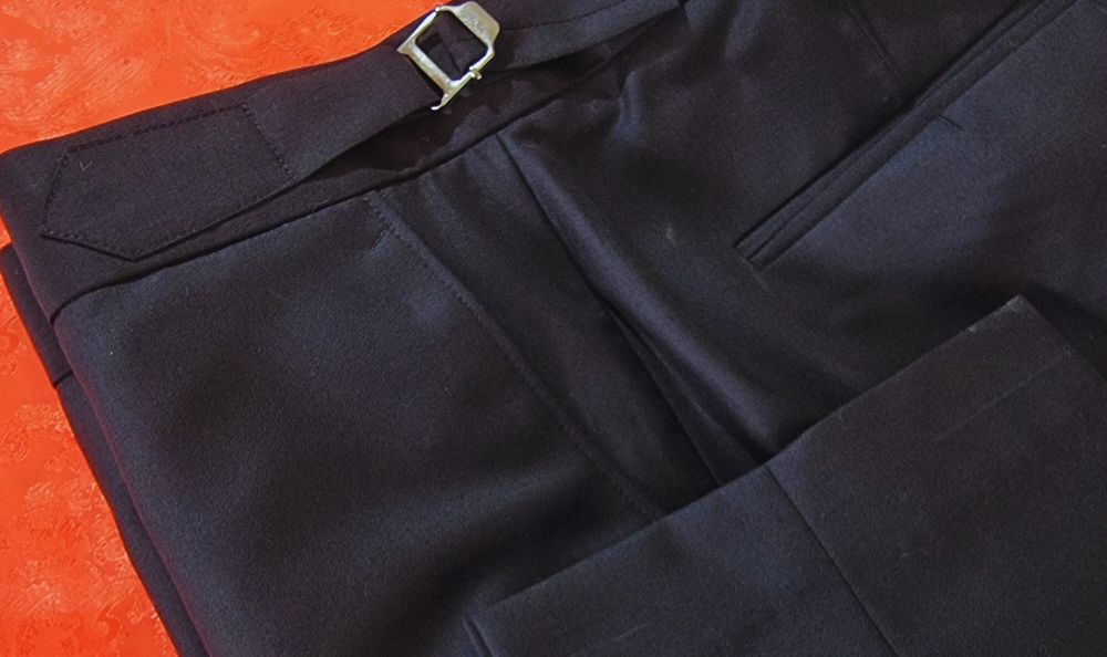 Navy tailored trousers with a silver side adjuster